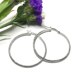 Sterling silver sparkly effect hoop earring
